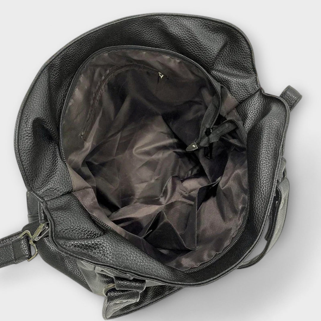 "Olivia - Elegante Hobo Schultertasche" can be rewritten as "Olivia - Stilvolle Hobo Schultertasche".