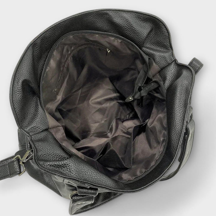 "Olivia - Elegante Hobo Schultertasche" can be rewritten as "Olivia - Stilvolle Hobo Schultertasche".