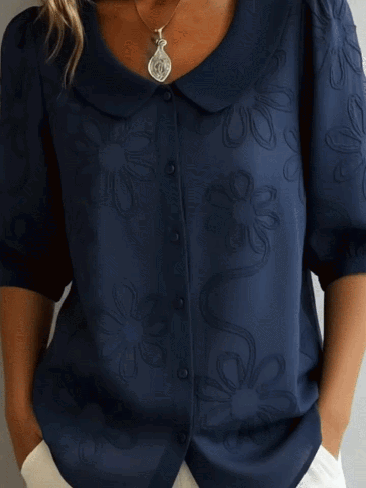 Verae™ | Elegante Blumenbluse" can be rewritten as "Verae™ | Stylish Floral Blouse.