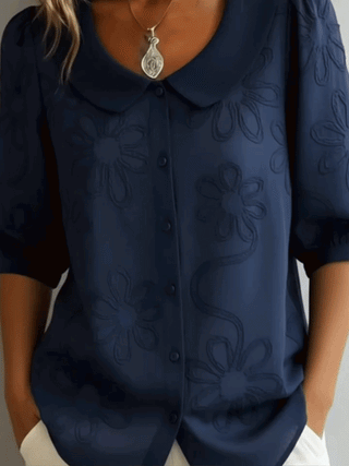 Verae™ | Elegante Blumenbluse" can be rewritten as "Verae™ | Stylish Floral Blouse.